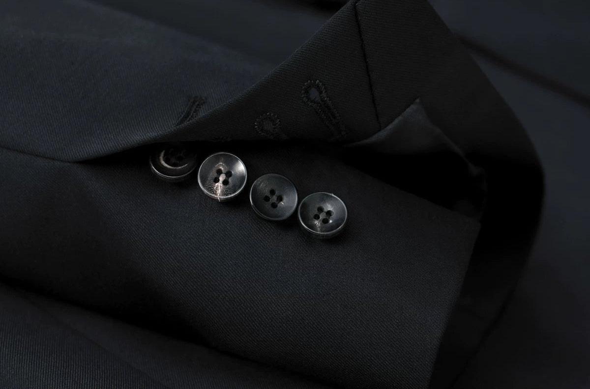 Detailed view of the jacket sleeve with unbuttoned functional cuff placket against Australian merino wool — From Borcelleclothes.