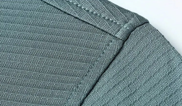 Detailed view of the structured shoulder seam and clean-finished armhole construction on the Bermuda Grey Mulberry silk polo — From Borcelleclothes.