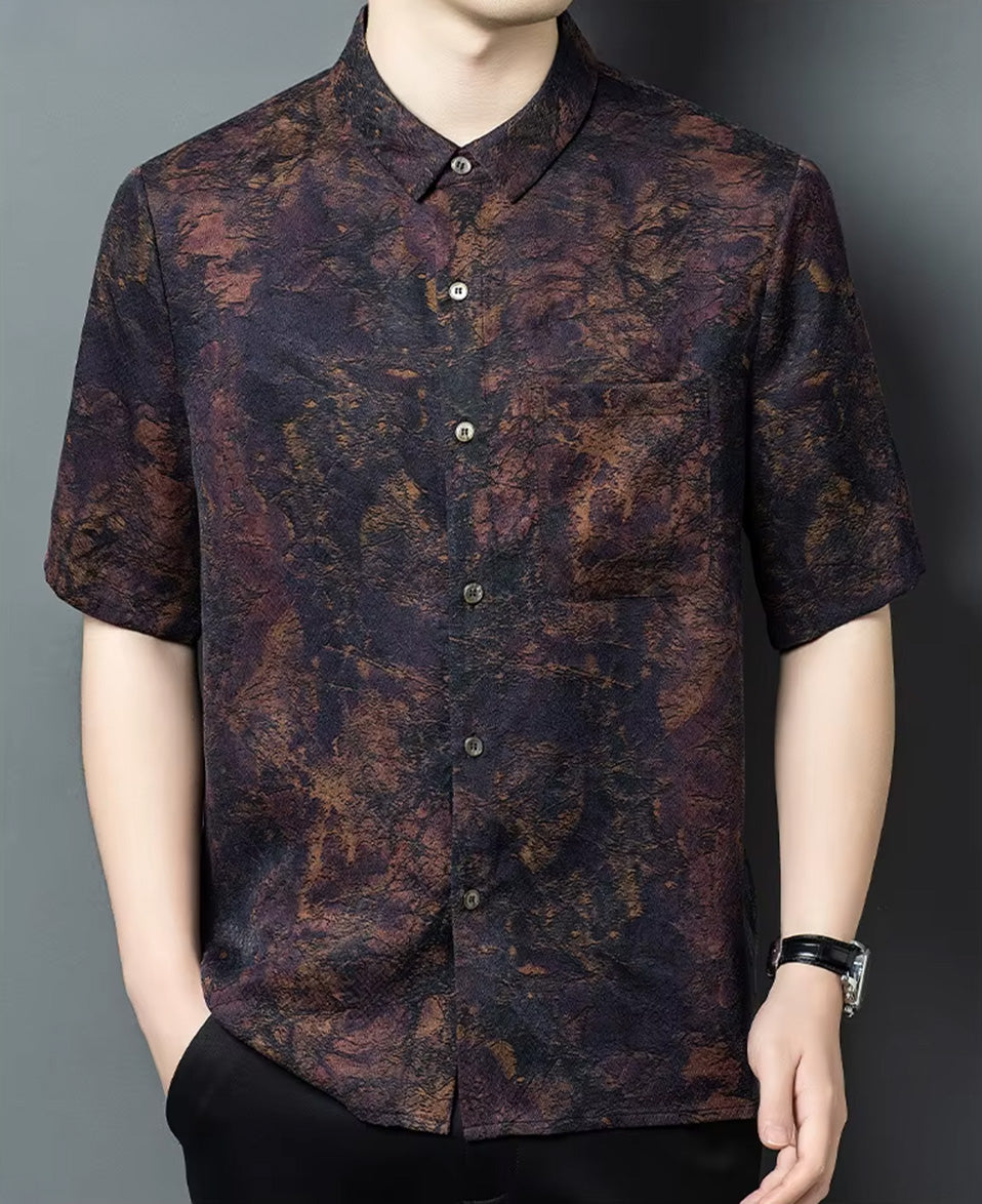 Confident pose of a man with one hand in his trousers pocket, wearing the luxury mottled Xiangyunsha silk shirt — From Borcelleclothes.