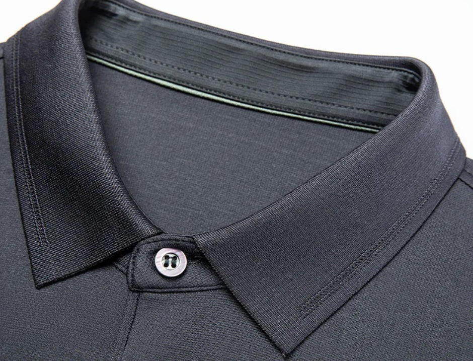 Close-up of Tender Night silk polo collar with double stitch detail that stops before the tip — an echo of the inside left visible. From Borcelleclothes.