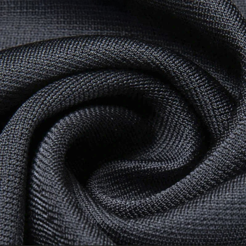 Spiral-folded Tender Night Mulberry silk fabric — soft sheen, fluid drape, and quiet tension beneath the surface. From Borcelleclothes.