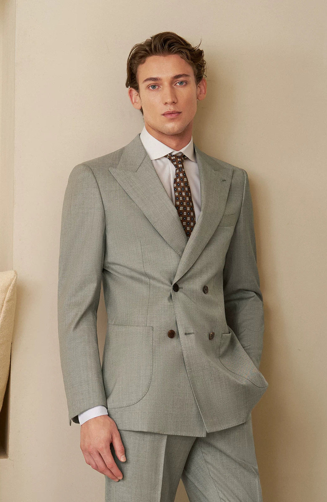 Model wearing Neapolitan VBC Super 110s wool suit with hand casually resting in trouser pocket — From Borcelleclothes.