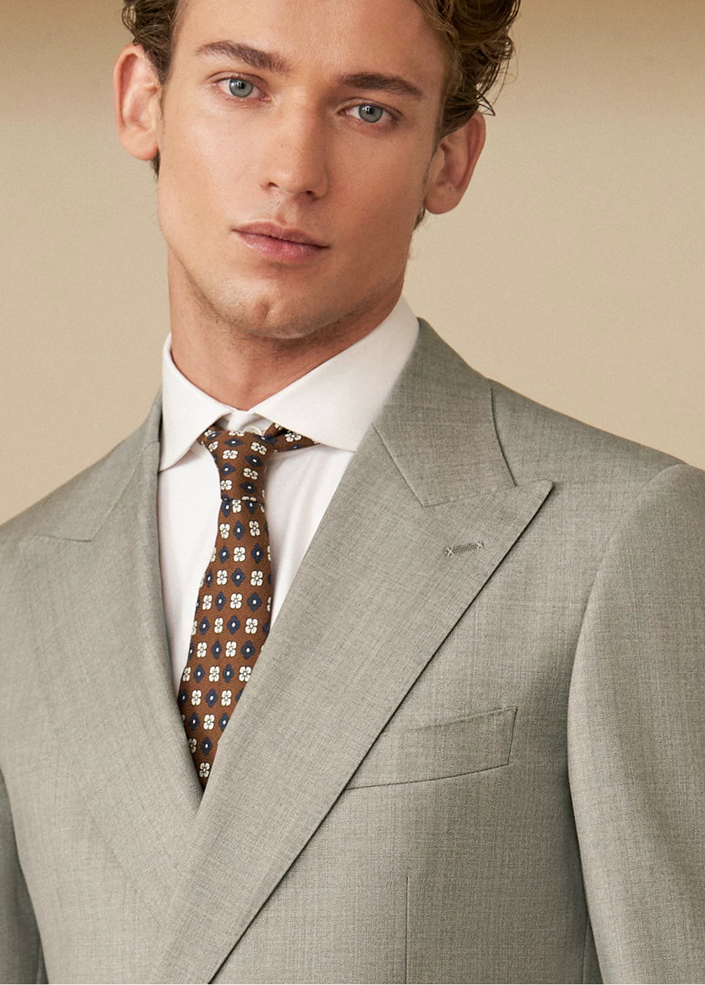 Front portrait of model wearing tailored Neapolitan VBC Super 110s wool jacket looking at camera — From Borcelleclothes.