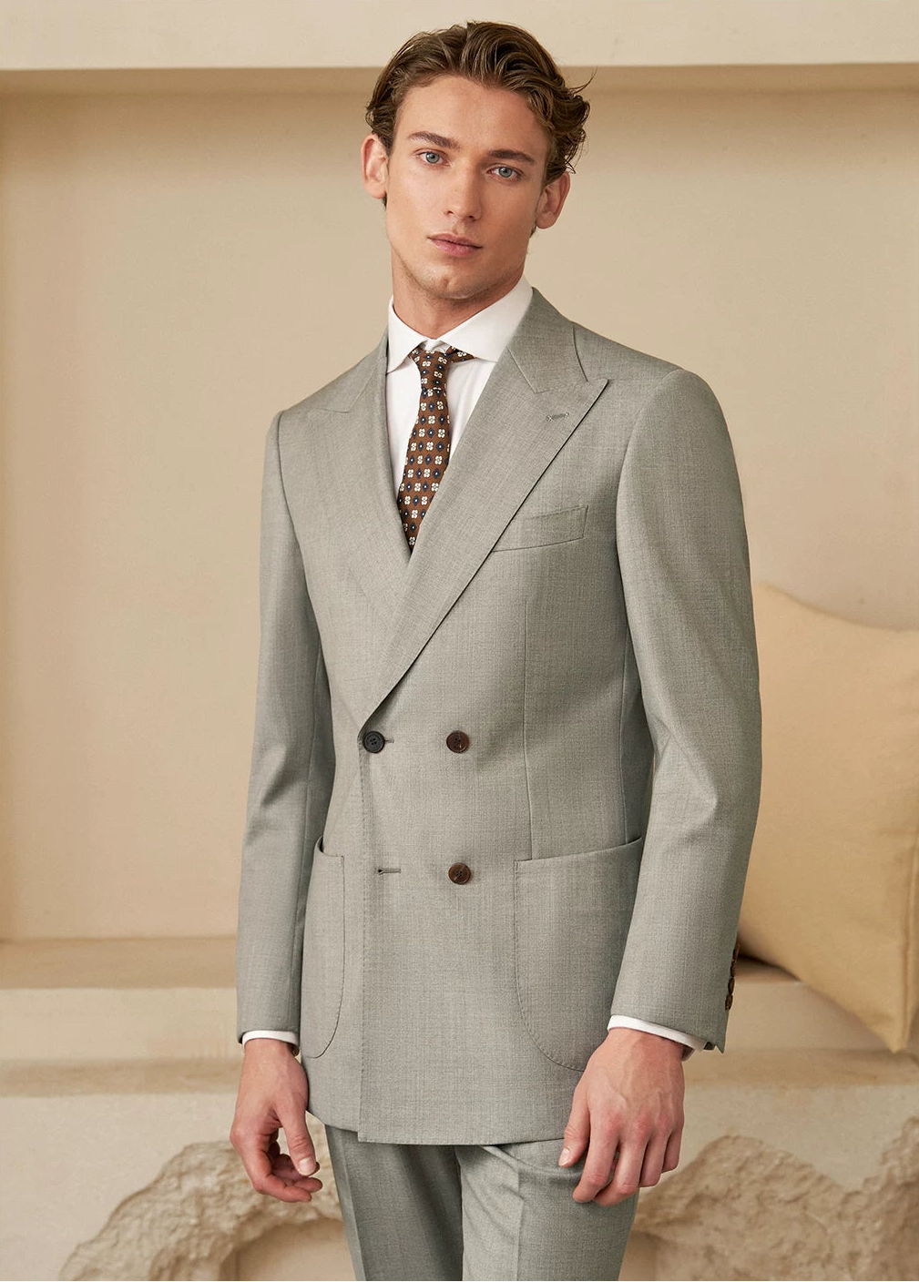 Three-quarter view of model showcasing soft shoulder tailoring in VBC wool suit — From Borcelleclothes.