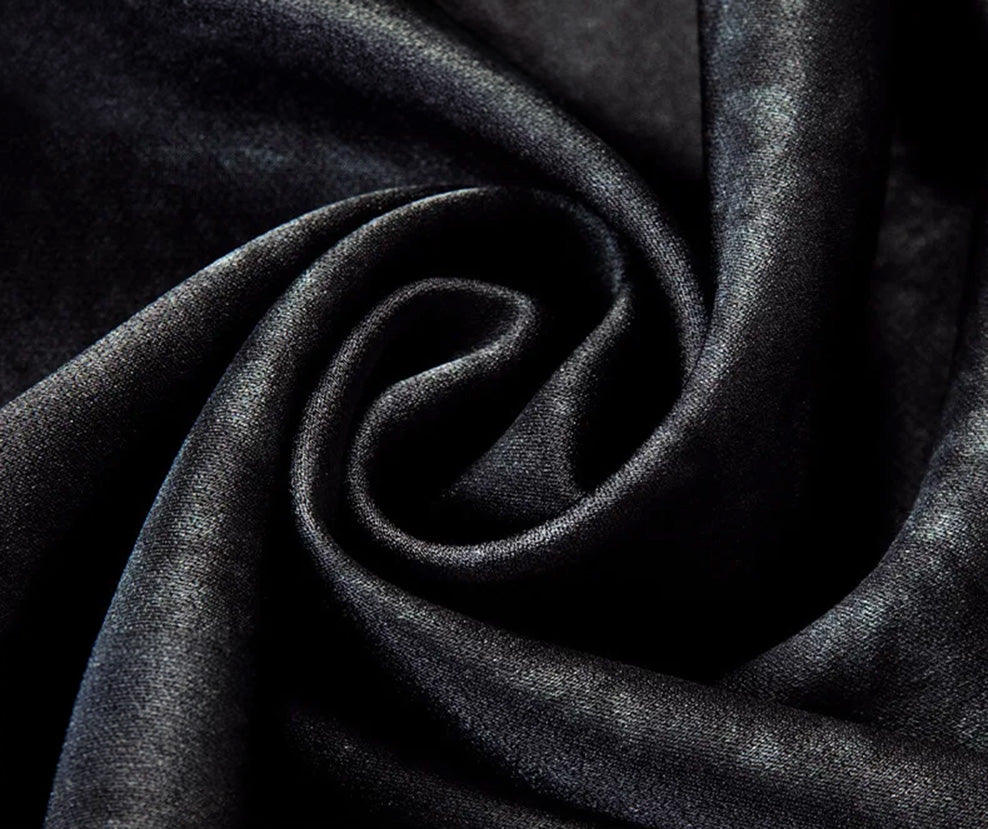 A detailed shot of the premium silk-elastane fabric in a spiral folded texture, displaying the organic matte-and-shine motif of the Martian labyrinth print — From Borcelleclothes.