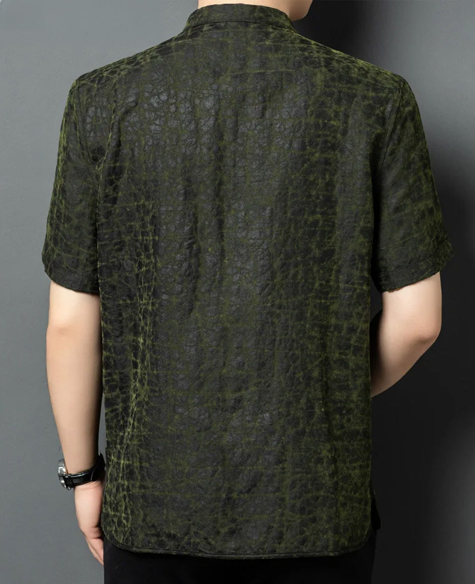 Full back view of a man modeling the reversible shirt-jacket on the solid matte-black face, emphasizing a clean and sharp architectural fit — From Borcelleclothes.