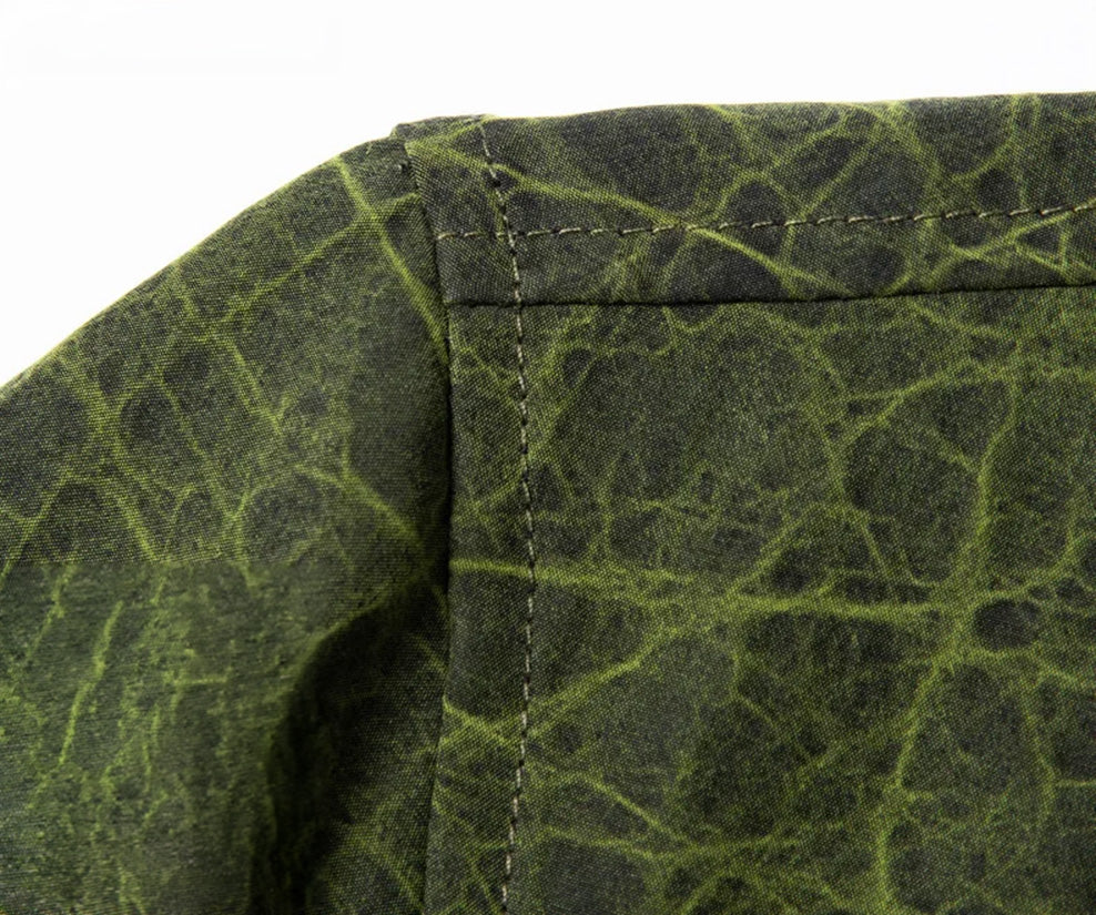 Detailed shot of the tailored shoulder seam on the Chartreuse Glow face, emphasizing the rigid, masculine frame of the silk fabric — From Borcelleclothes.