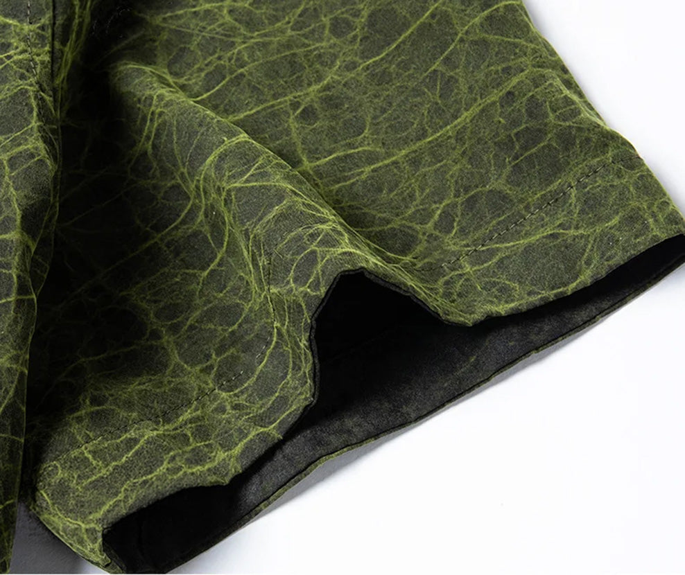 Detailed view of the tailored set-in short sleeve on the Chartreuse Glow side, showing the dense, leather-like micro-texture of the silk — From Borcelleclothes.