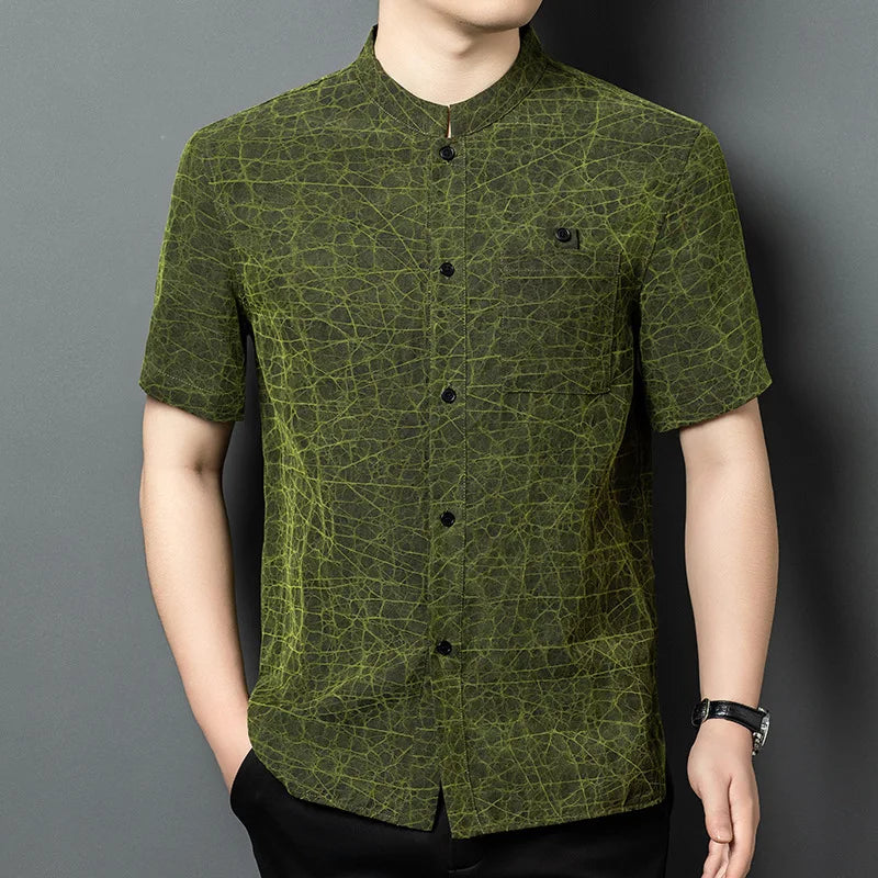 Men's reversible shirt-jacket in Chartreuse Glow color, made of Xiangyunsha Mulberry silk, highlighting the natural mud-cracked texture with mineral coloration and a structured Mandarin collar. — From Borcelleclothes.