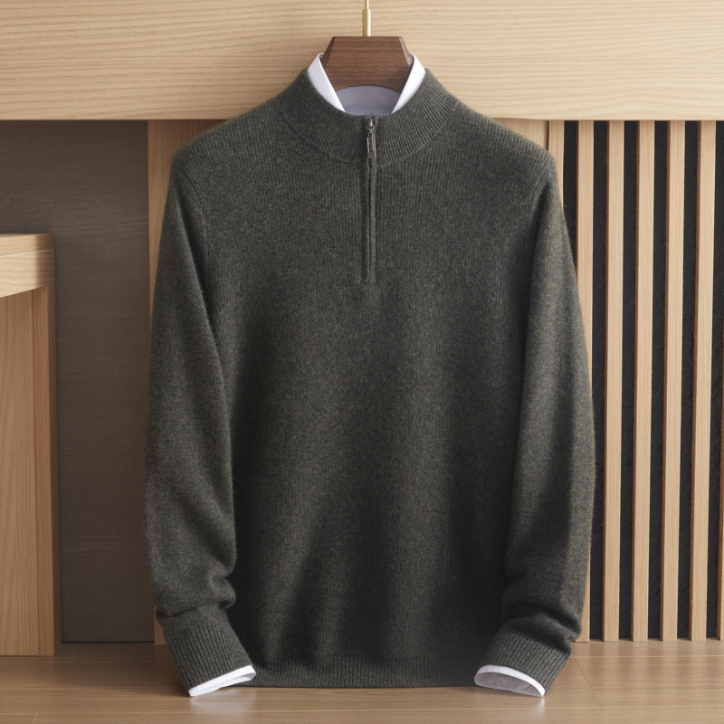 Front view of the men’s ribbed Arbas cashmere half-zip sweater in Moss Glen olive green displayed on a wooden hanger — From Borcelleclothes.