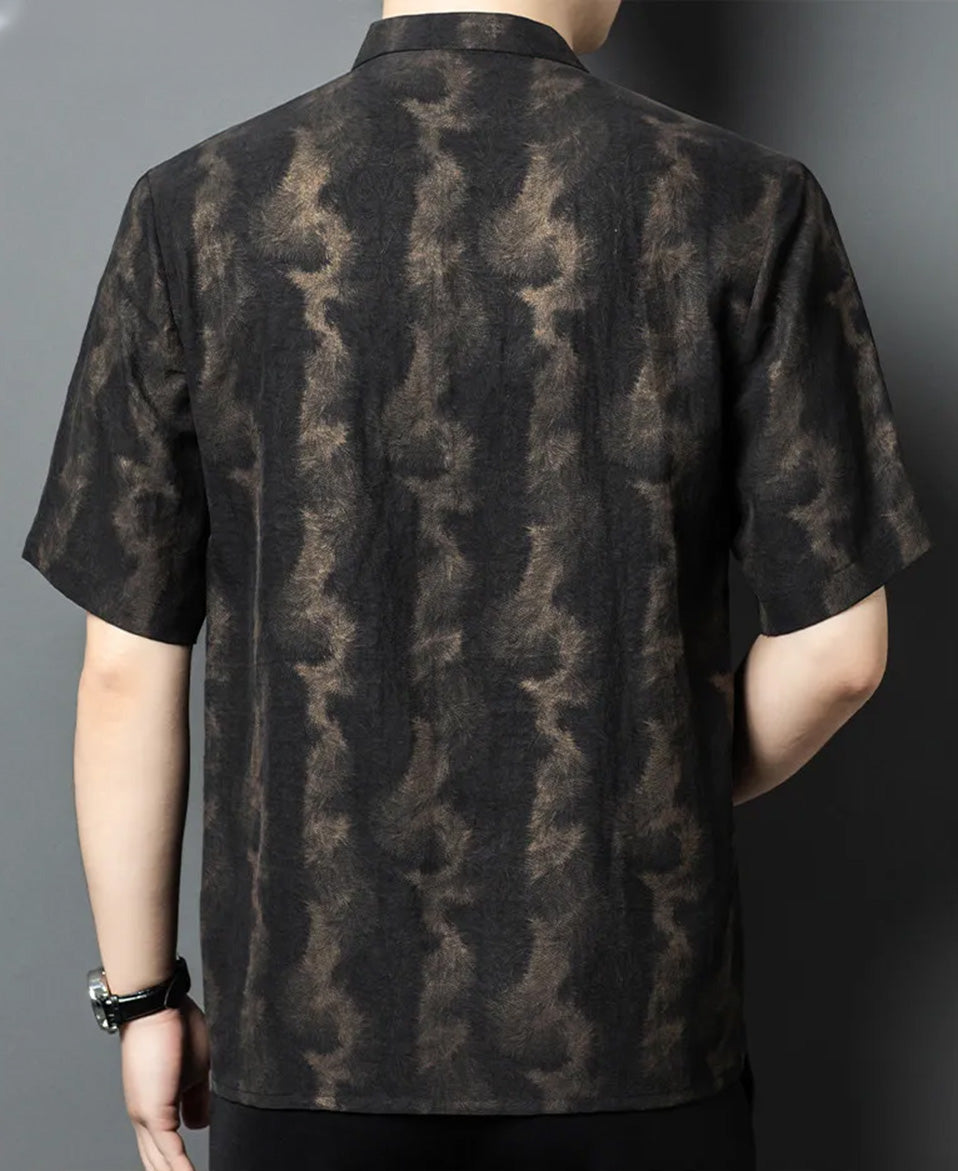 Back view of a model wearing Men's Xiangyunsha silk shirt in Rutilated Graphite color, featuring a unique handmade needle-like amber pattern — From Borcelleclothes.