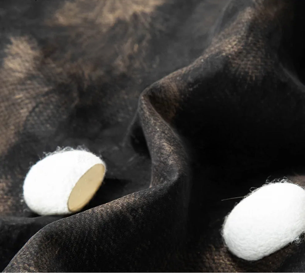 Wave-folded texture of Men's Xiangyunsha silk shirt in Rutilated Graphite color, showcasing the unique handmade needle-like amber pattern on matte-graphite monochrome — From Borcelleclothes.