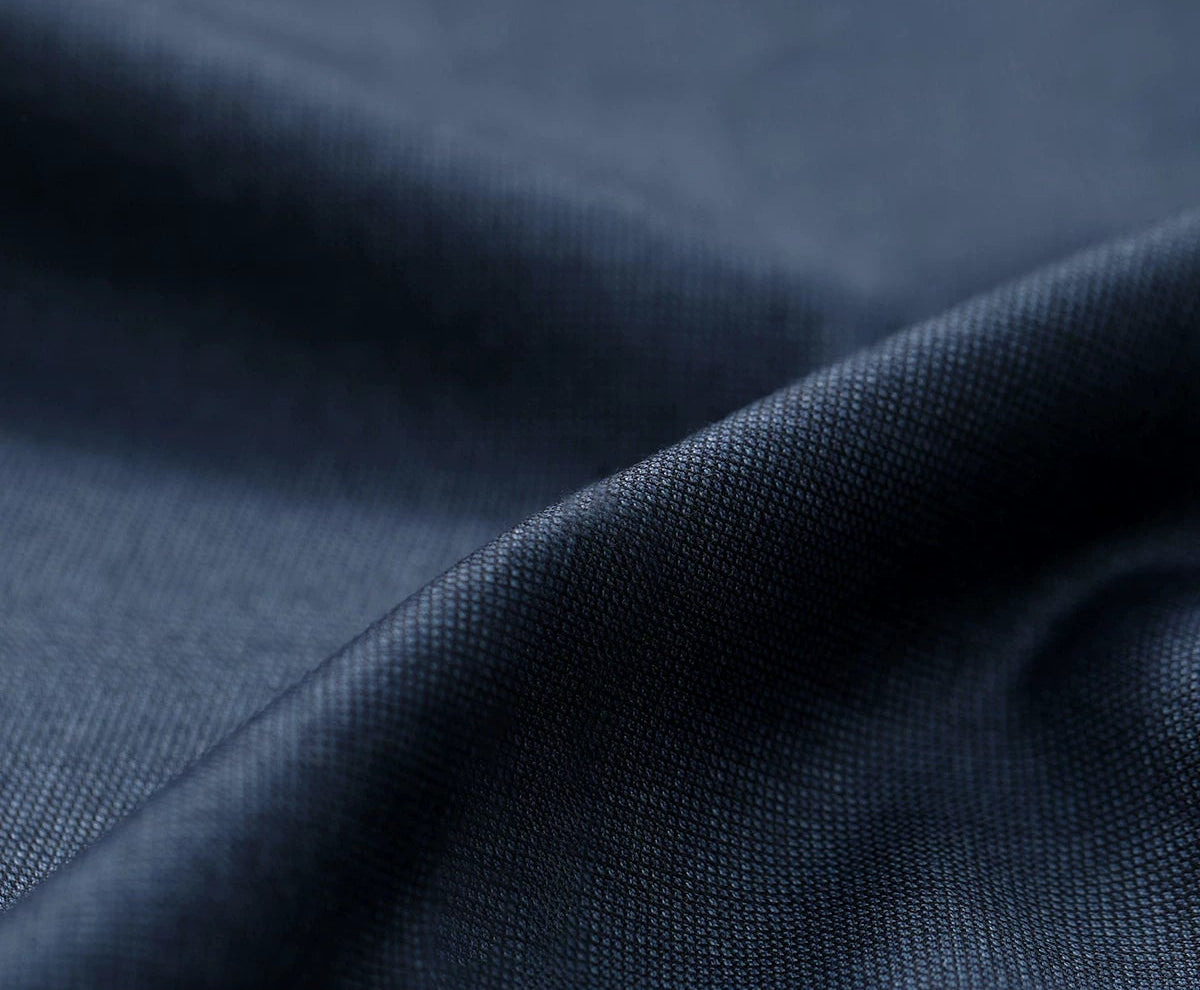 Close-up texture of 340 g/m² Vitale Barberis Canonico Super 110’s Salt Wave blue-gray melange wool fabric — From Borcelleclothes.