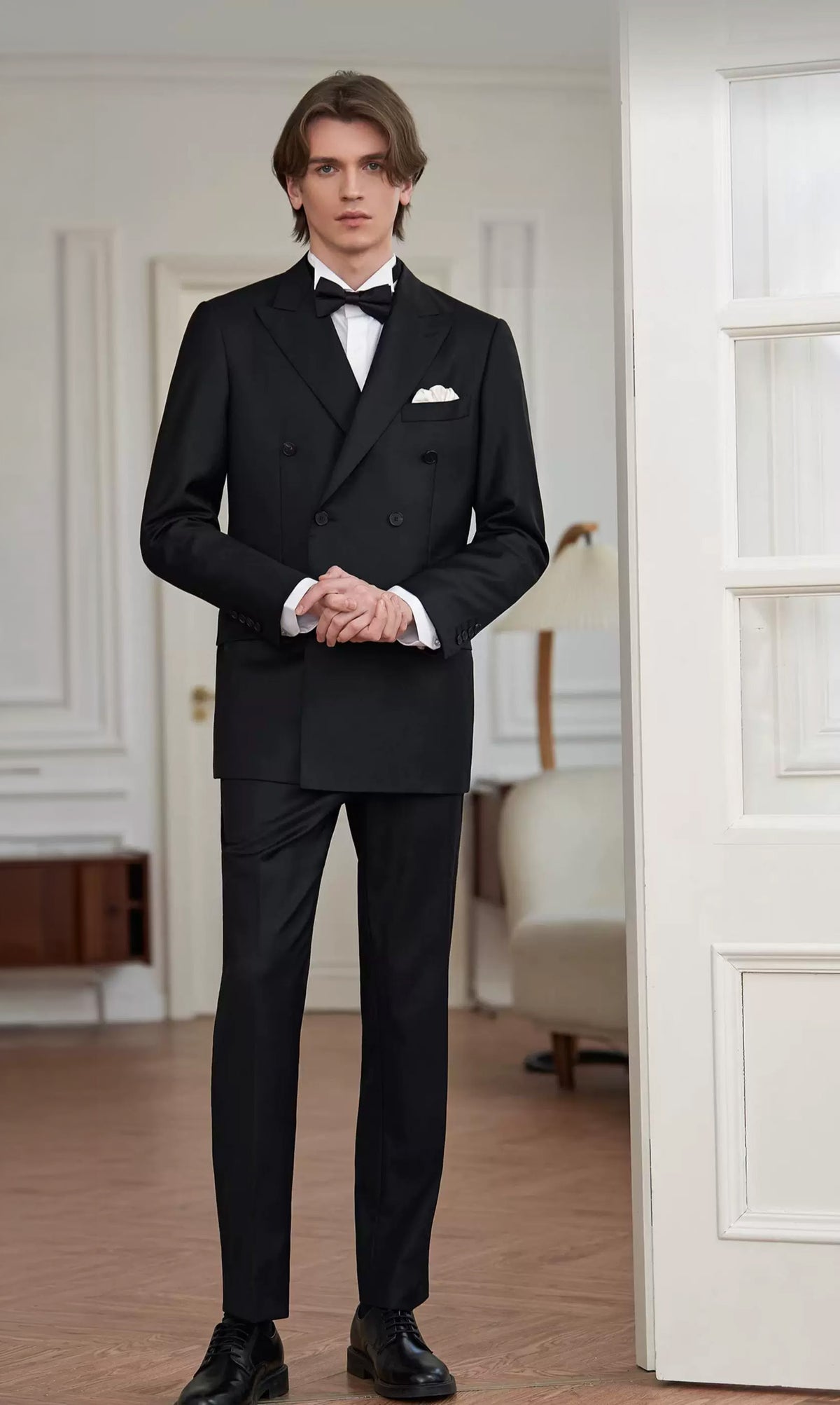 Dramatic close-up of the model nervously clasping his hands in the Pianissimo double-breasted suit before his stage debut — From Borcelleclothes.