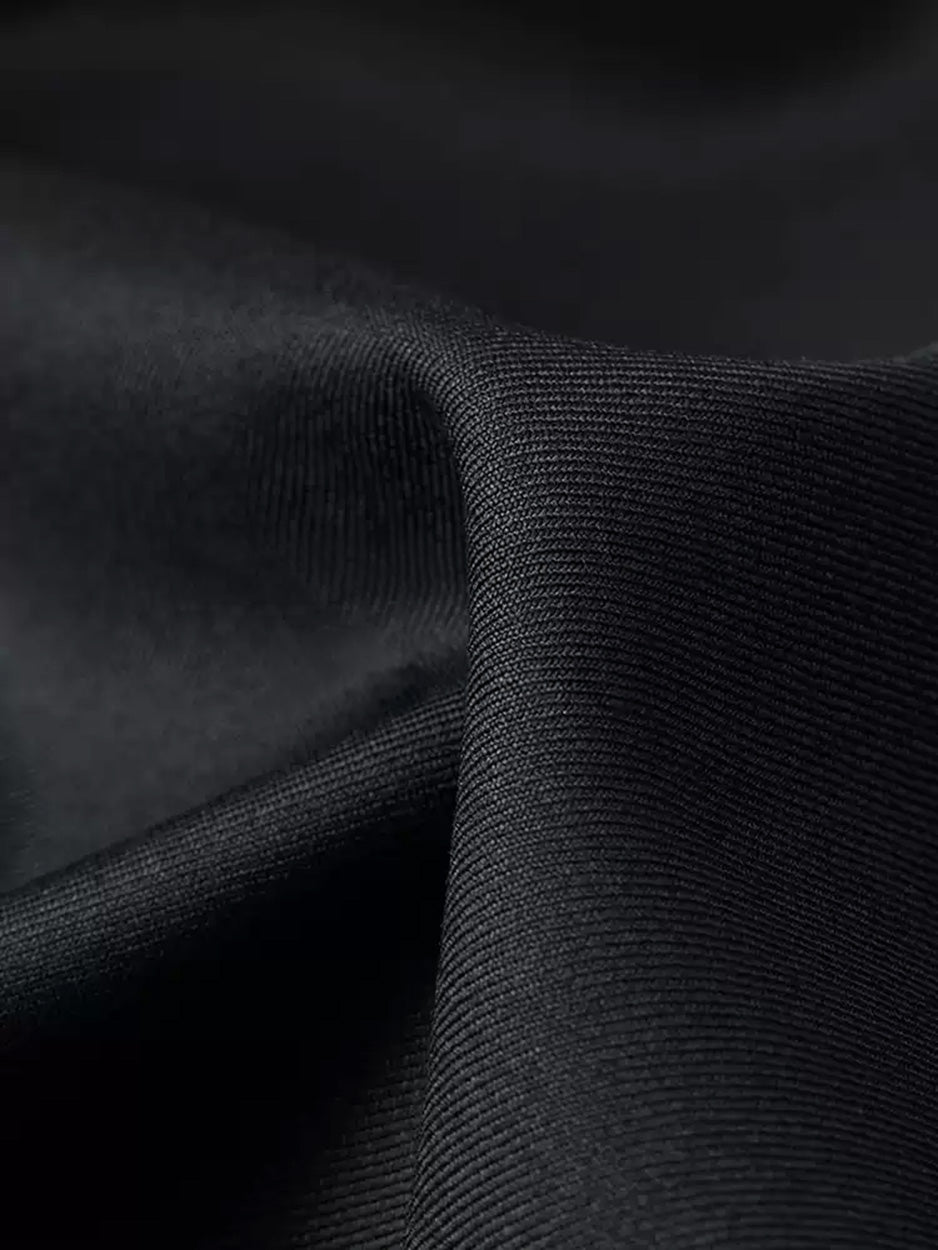 Macro close-up of the Vitale Barberis Canonico Super 110’s pure Merino wool twill fabric in Pianissimo black — From Borcelleclothes.