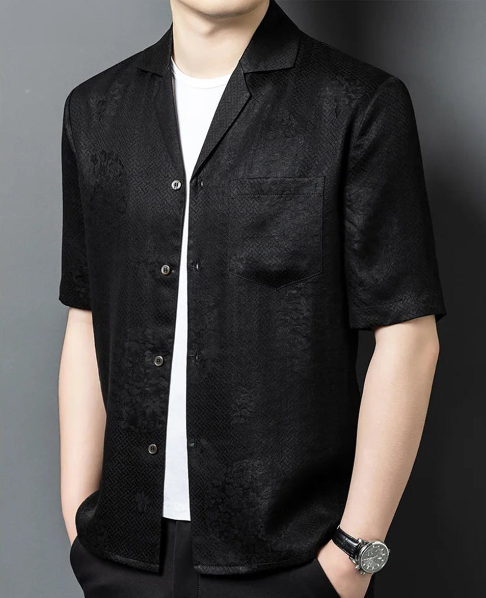 Three-quarter portrait of a man in the relaxed Suzhou silk shirt-jacket, showcasing how the geometric pattern dynamically shifts and vanishes depending on the lighting angle. — From Borcelleclothes.