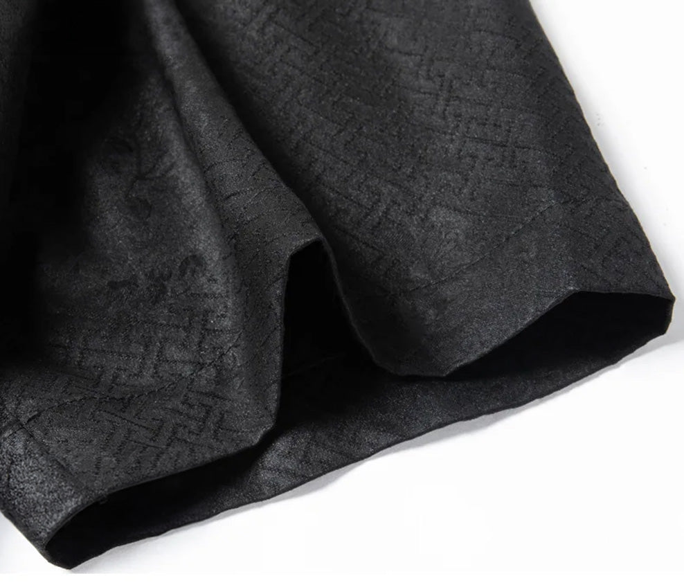 Focus on the relaxed short sleeve hem of the men's silk shirt-jacket, showing the clean, professional edge stitching and the fluid hang of the fabric. — From Borcelleclothes.