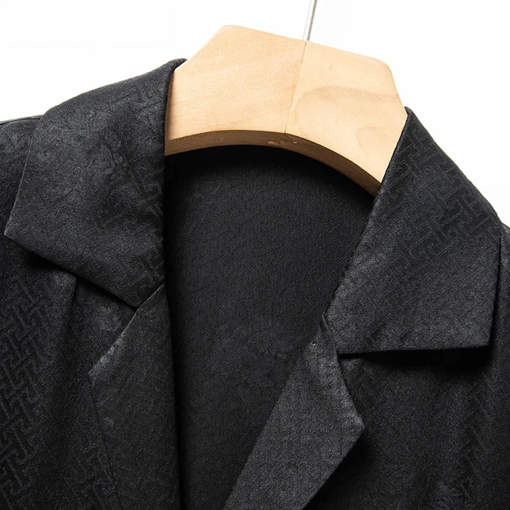 Focus on the upper silhouette of the men's dark green silk jacquard overshirt, highlighting the balanced proportions of the relaxed chest and shoulder drape. — From Borcelleclothes.