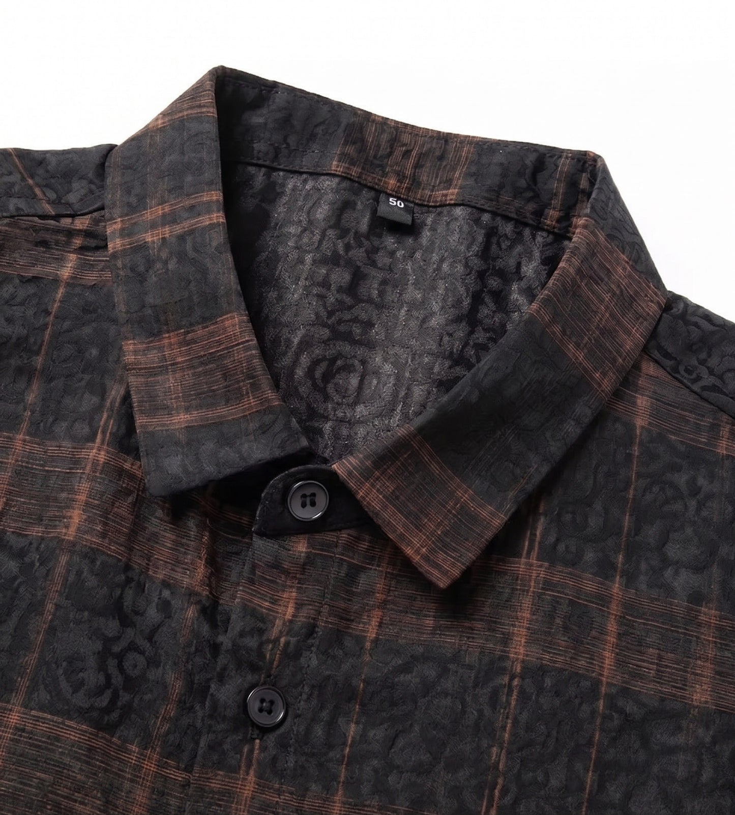 Pointed collar of a men's matte graphite jacquard silk shirt, showcasing the clean lines and cognac check architecture, from Borcelleclothes.