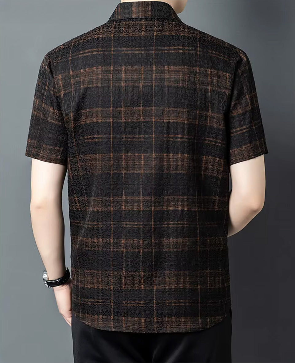 Tailored shoulder panels and back silhouette of a men's graphite and cognac check jacquard silk shirt on a man, from Borcelleclothes.