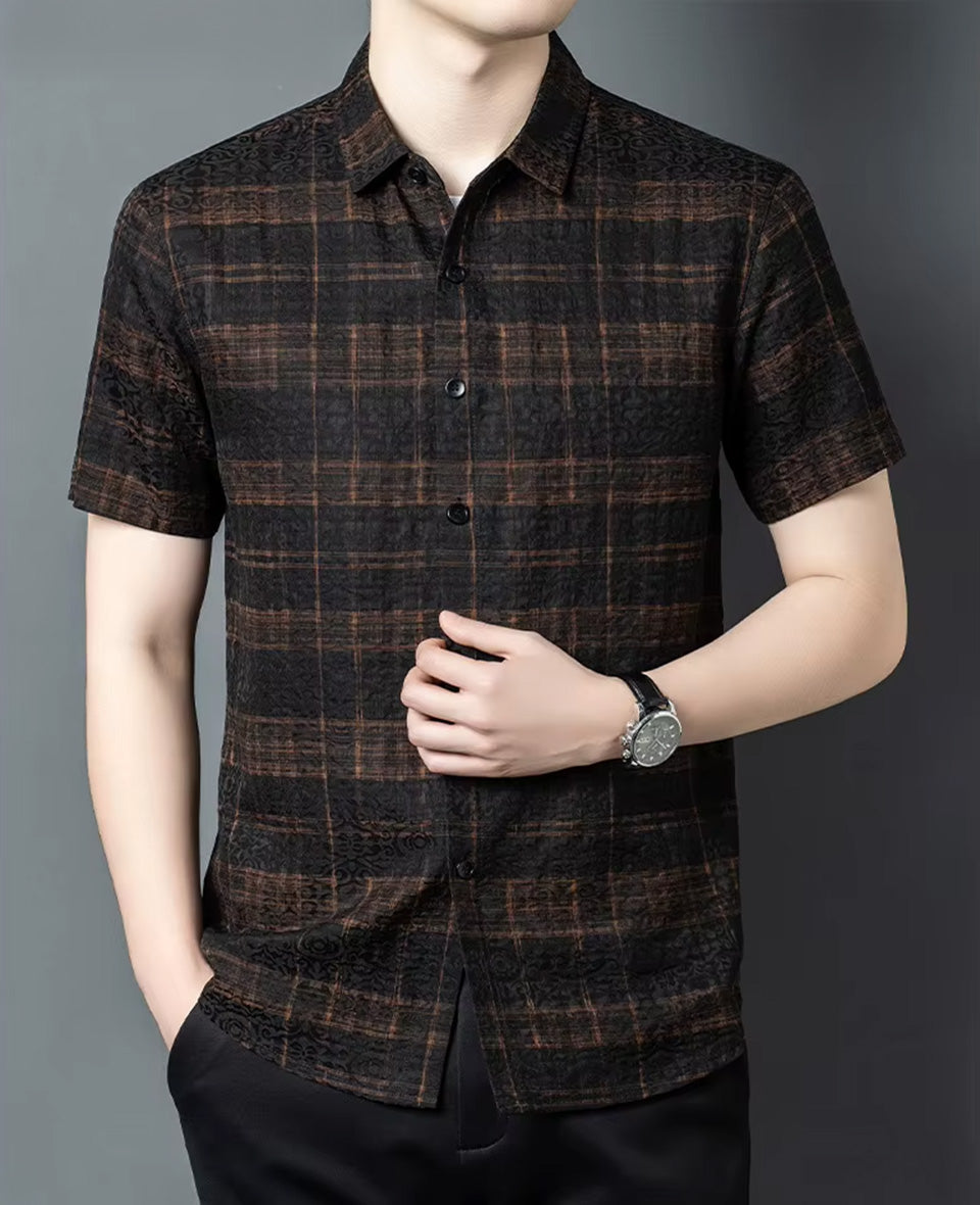 Button placket on a men's short-sleeve graphite silk shirt with a cognac check weave, touched by a man's hand, from Borcelleclothes.
