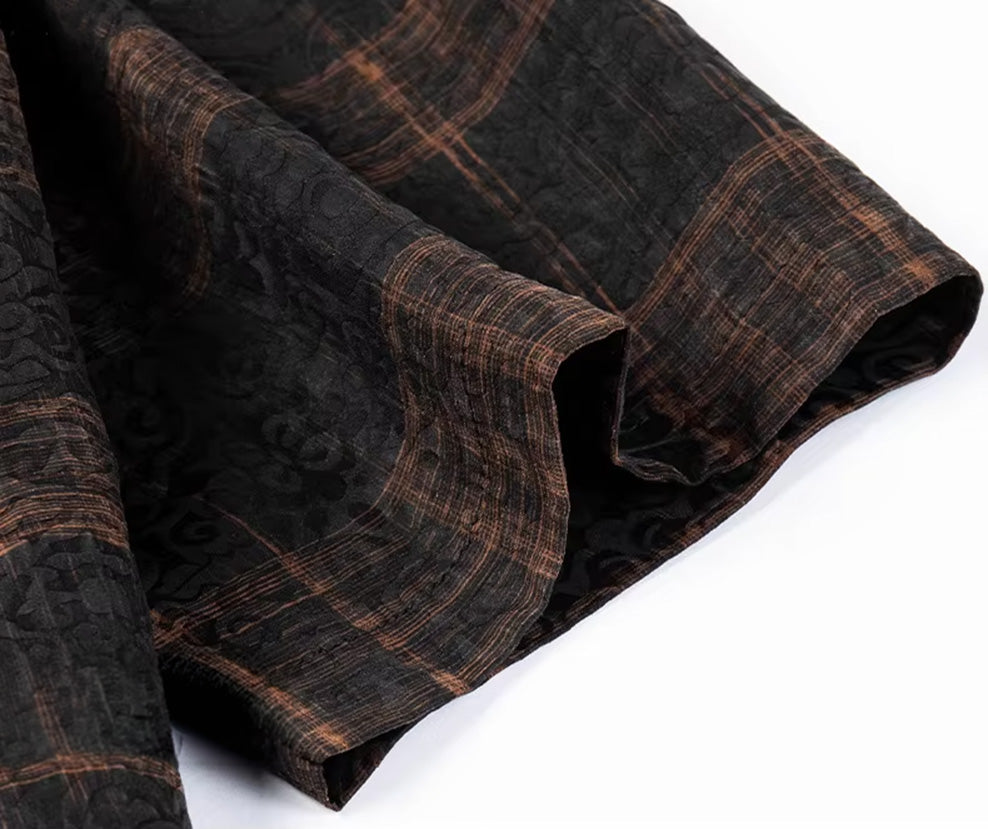 Short sleeve hem of a men's graphite silk shirt, emphasizing the rigid framework of the cognac check pattern, from Borcelleclothes.