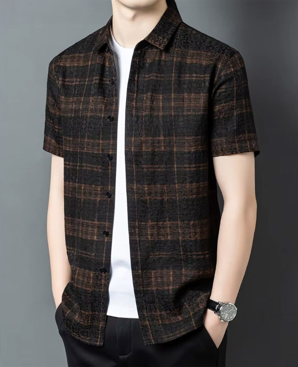 Men's unbuttoned short-sleeve jacquard silk shirt in baroque graphite and cognac check, shown in a side profile on a man, from Borcelleclothes.