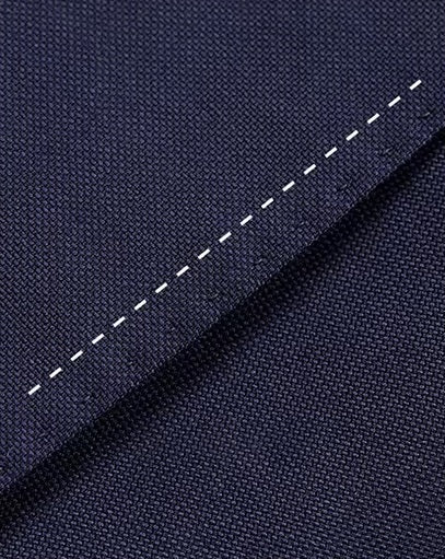 The straight stitching on the Borcelleclothes Men's VBC Navy Blue Wool Suit with Brass Accents, showcasing the precision of the tailoring.