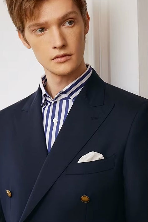 The upper part of the Borcelleclothes Men's VBC Navy Blue Wool Suit with Brass Accents, focusing on the double-breasted blazer, brass buttons, and peaked lapels.