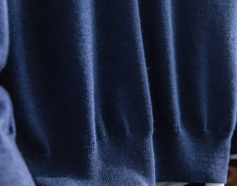 Lower hem view of the Ceylon Sapphire worsted cashmere pullover showing resilient ribbed trim and smooth jersey stitch — From Borcelleclothes.