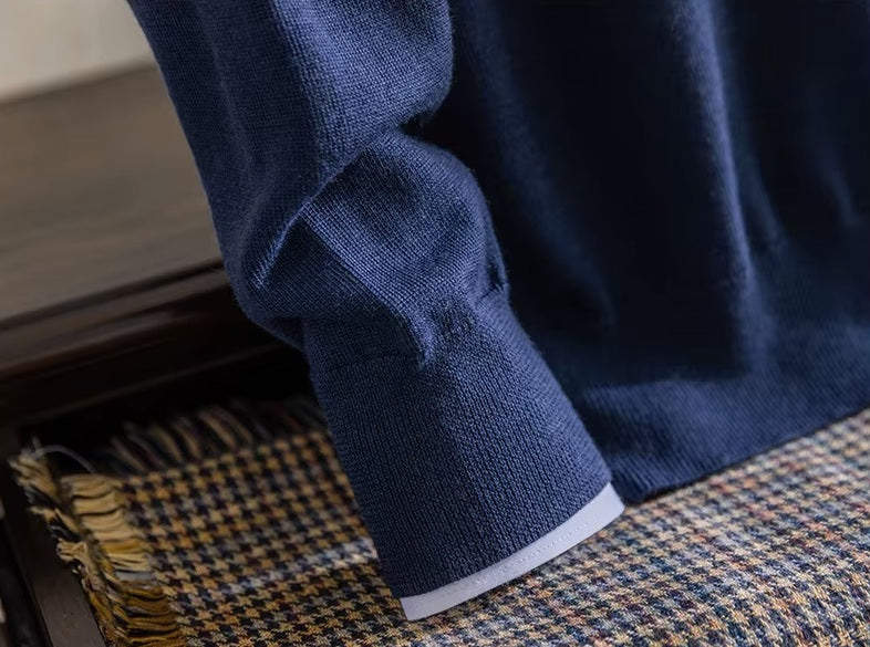 Macro shot of the fine 1x1 ribbed sleeve cuff on the Ceylon Sapphire worsted cashmere pullover — From Borcelleclothes.