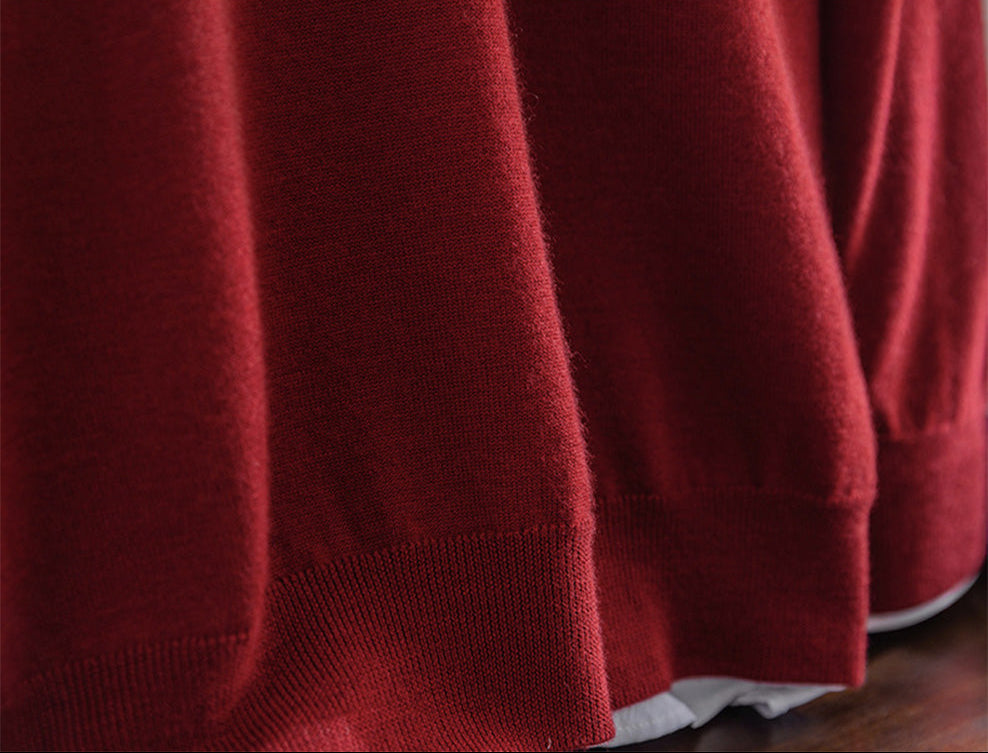 Detailed view of the lower hem and dense worsted cashmere knit structure in Cut Ruby — From Borcelleclothes.