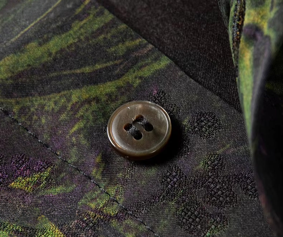 Macro shot of a button on the single-breasted placket of the Film Exposure Xiangyunsha silk shirt — From Borcelleclothes.