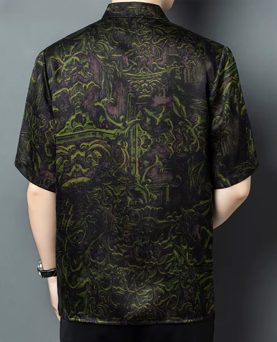 Back view of a man modeling the single-breasted Xiangyunsha mulberry silk shirt, showcasing the fluid twilight forest print — From Borcelleclothes.