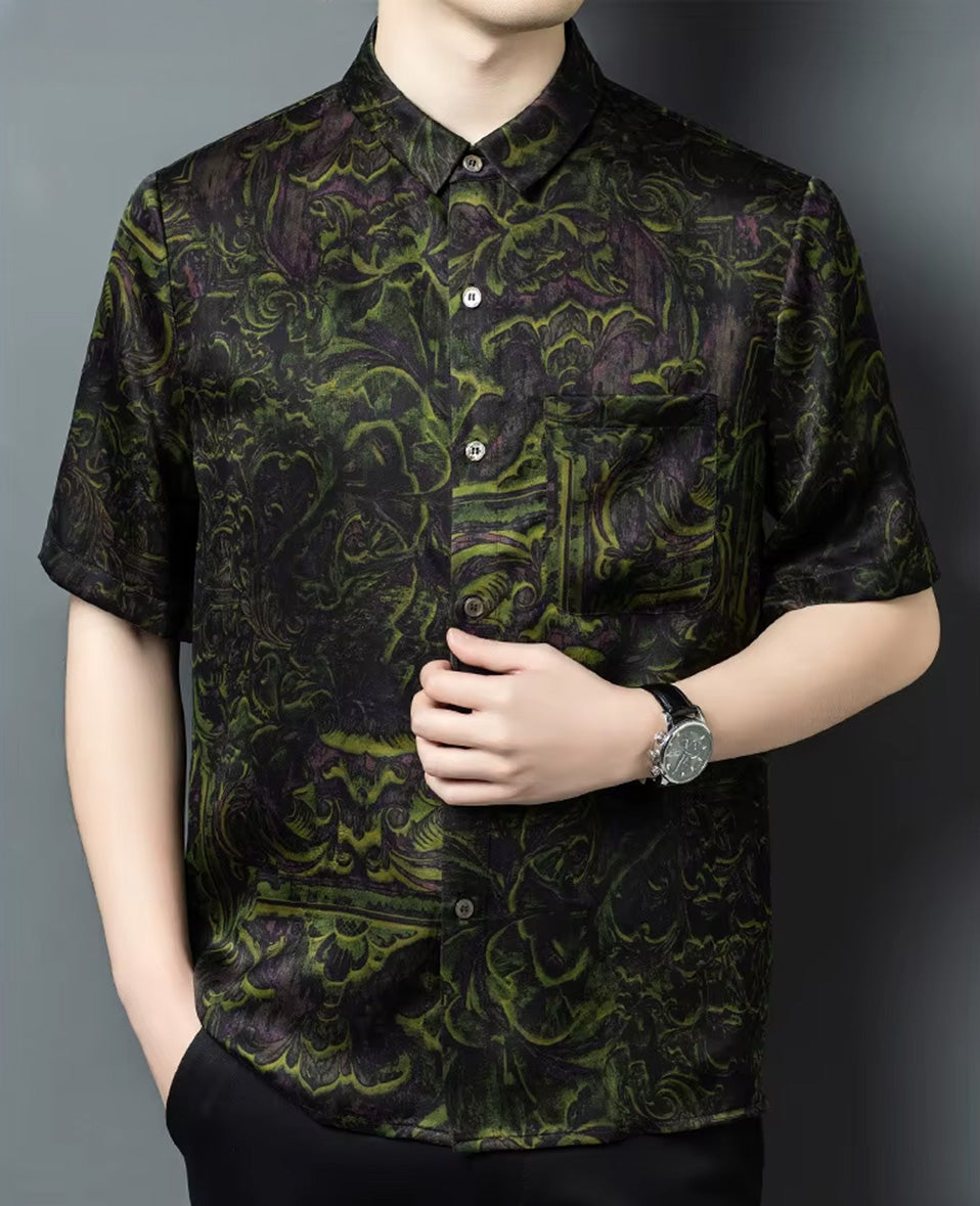 Close-up of a man touching the front placket of the short-sleeve Xiangyunsha silk shirt in Film Exposure color — From Borcelleclothes.