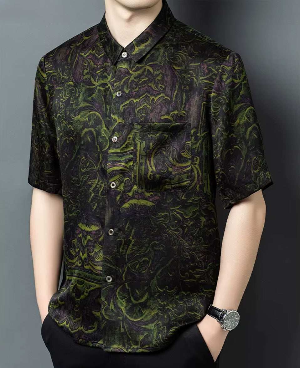 A man wearing the luxury foliage motif Xiangyunsha silk shirt, turned slightly to the side to display the relaxed, dignified drape — From Borcelleclothes.