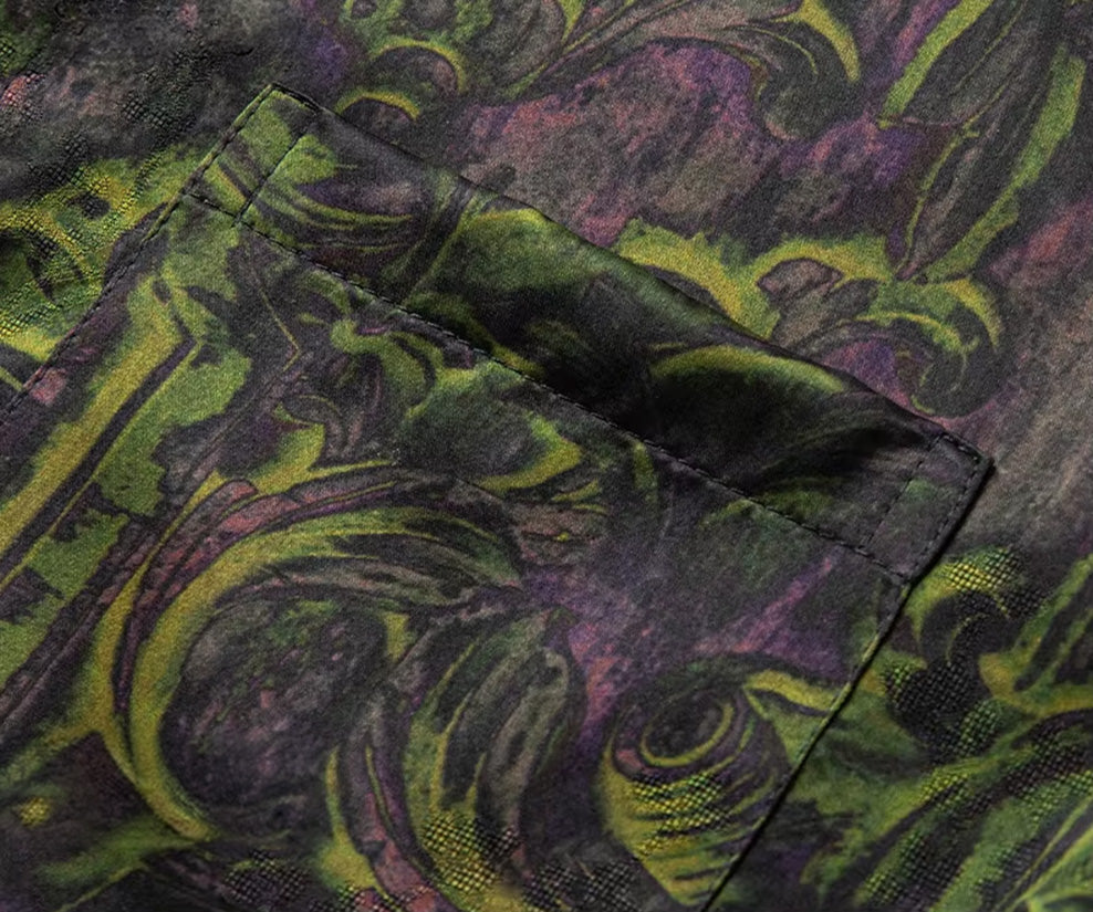 Detailed view of the left chest patch pocket, seamlessly integrated into the chartreuse foliage motif of the silk shirt — From Borcelleclothes.