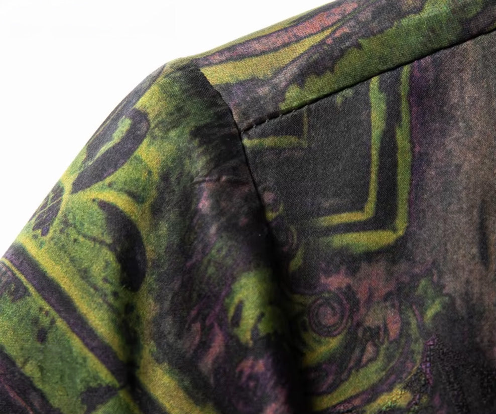 Close-up of the shoulder seam and the continuous botanical graphic on the premium Xiangyunsha silk shirt — From Borcelleclothes.