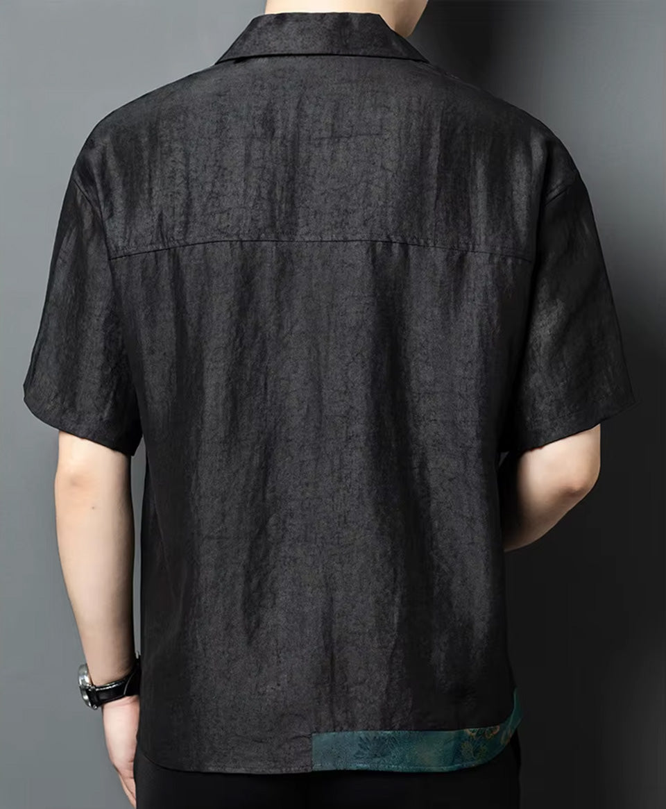Rear view of a man wearing the relaxed Xiangyunsha silk shirt-jacket, highlighting the clean horizontal line of the classic back yoke — From Borcelleclothes.