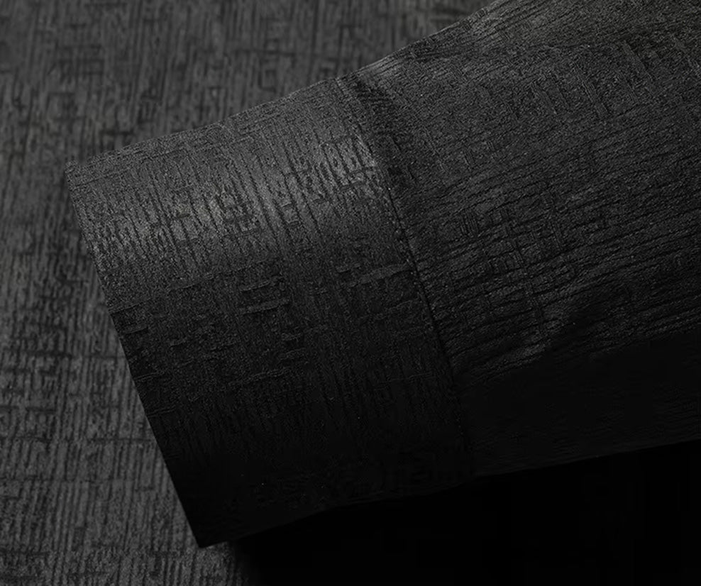Detail of the long sleeve cuff and placket on the heavyweight black silk shirt, finished with a matching genuine mother-of-pearl button - From Borcelleclothes.