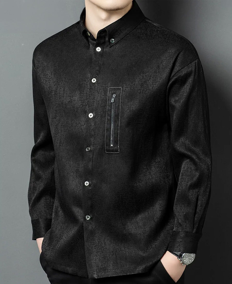A men's heavyweight graphite-black Mulberry silk shirt on a model turned slightly to the side, showcasing the structured drape, three-dimensional jacquard texture, and a metal chest zipper - From Borcelleclothes.
