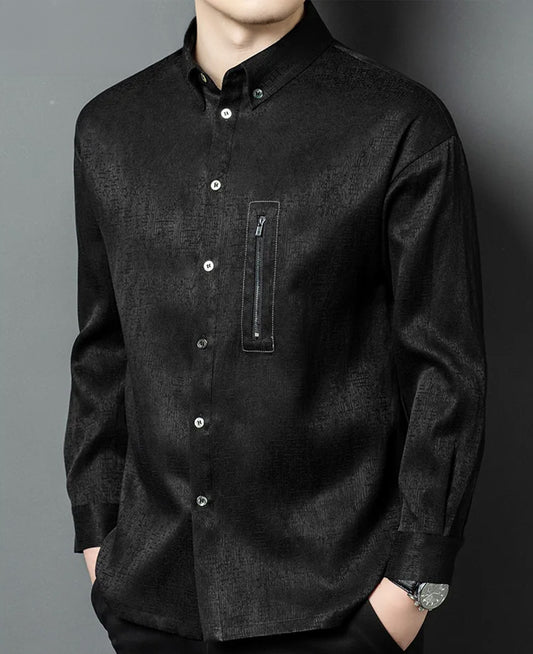 A men's heavyweight graphite-black Mulberry silk shirt on a model turned slightly to the side, showcasing the structured drape, three-dimensional jacquard texture, and a metal chest zipper - From Borcelleclothes.