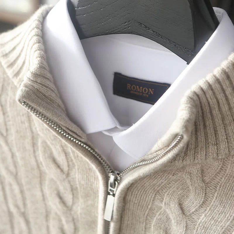 Unzipped collar of a Men’s cable cashmere sweater in Shaken Not Stirred color, with braided detailing, mock neck zip, and dropped shoulders —  From Borcelleclothes. 