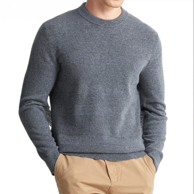 Model wearing the Men's Cashmere Crew Neck Sweater in Oslo Grey with hands in pants pockets, showcasing its versatile and polished style. From Borcelleclothes.