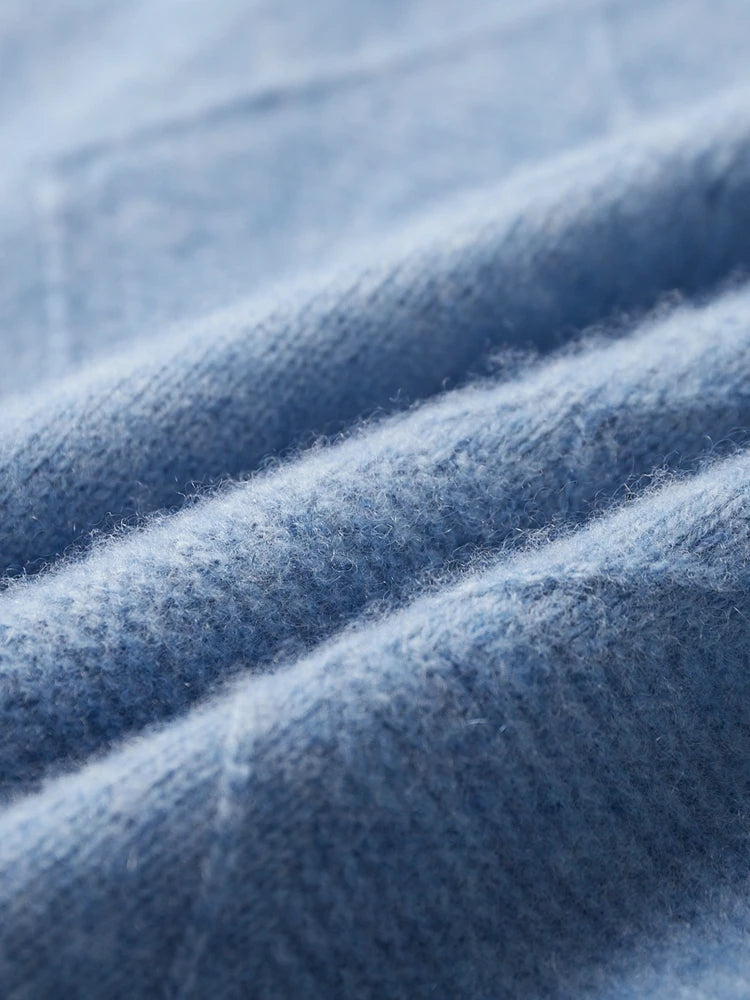 Wave-folded texture showing the depth of the Rock Blue knit — From Borcelleclothes.