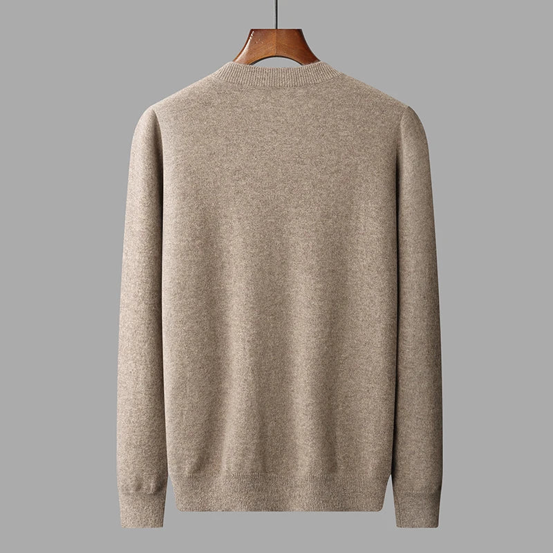 The Back of the Men's Cashmere V-Neck Sweater in Sandrift, featuring smooth stockinette stitching and a clean, polished silhouette. From Borcelleclolthes.