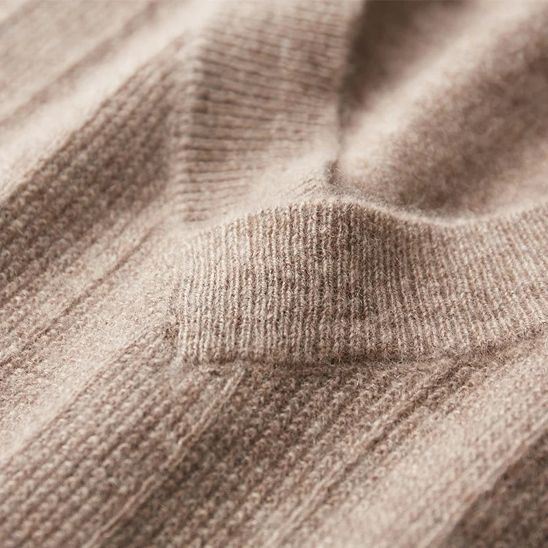 The wide wrapped hem on the Men's Cashmere V-Neck Sweater, emphasizing its distinctive angled neckline and modern design. From Borcelleclothes.