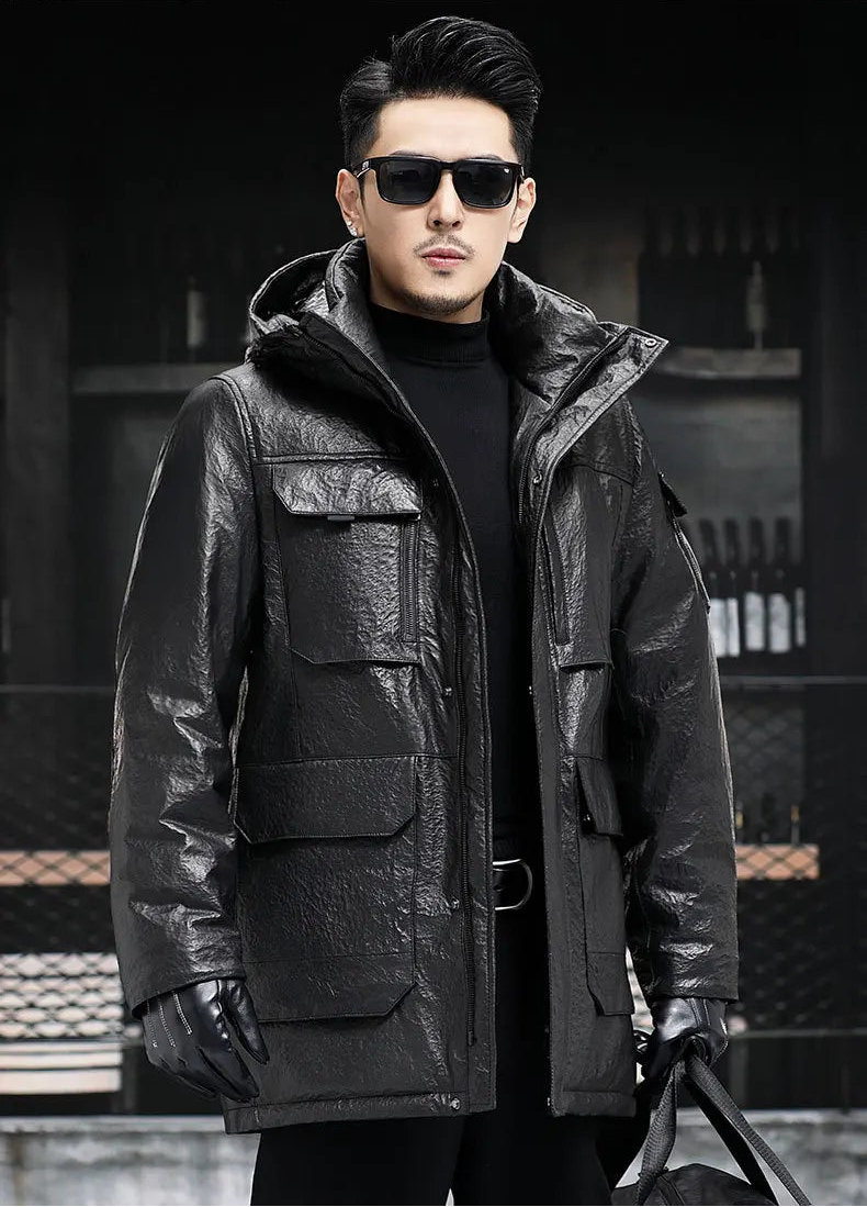 Model in Onyx compressed cowhide jacket holding an oversized dark-toned bag — From Borcelleclothes.