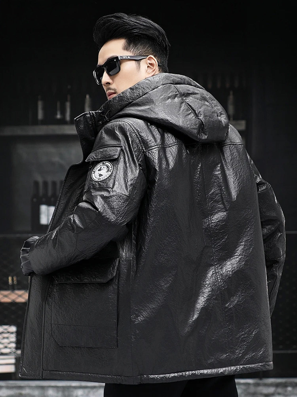 Back view of the jacket with hood and structural seams, model unzipped — From Borcelleclothes.