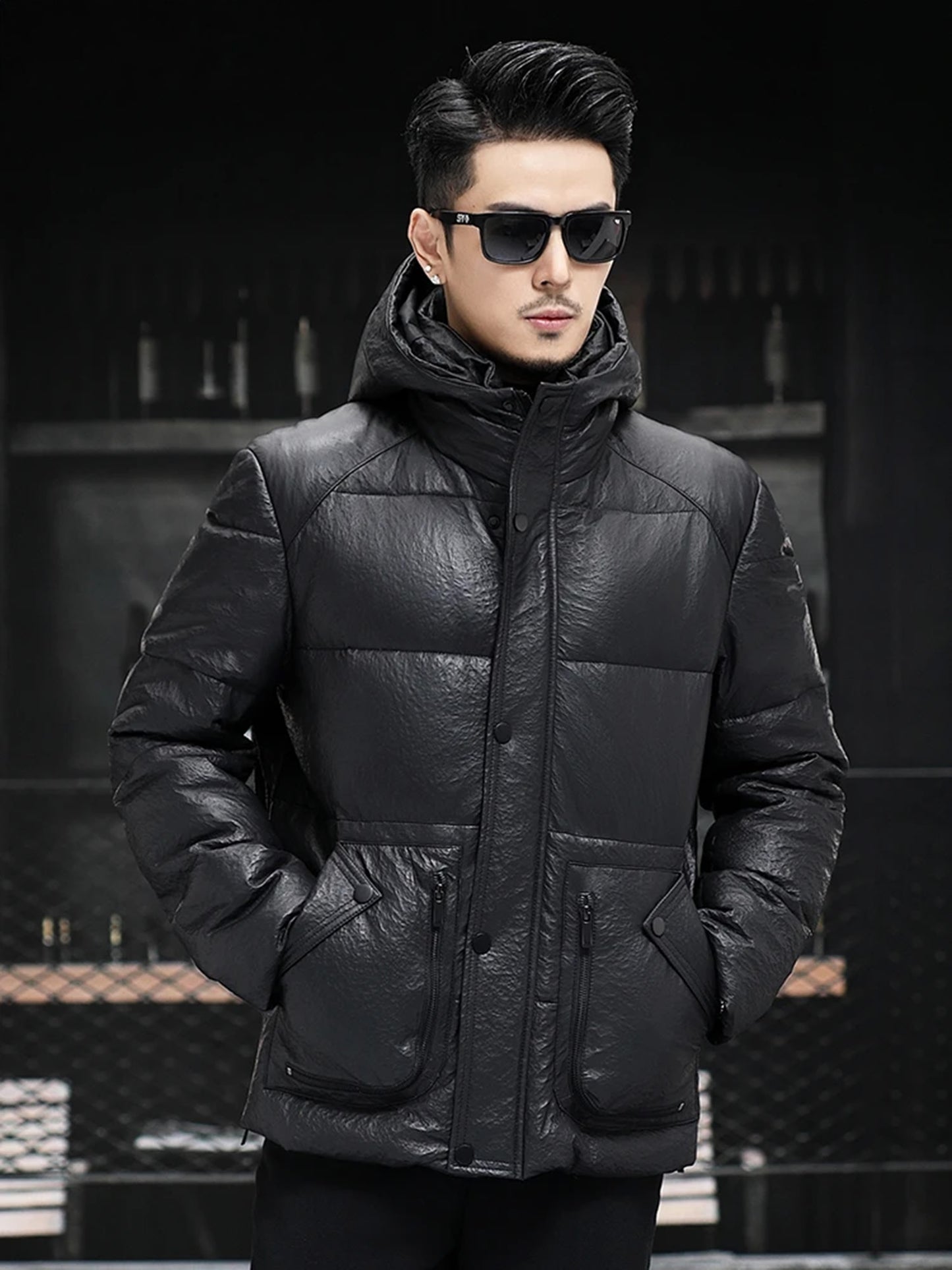 Model wearing the men’s compressed down sheepskin jacket in Onyx, hands tucked in the side pockets — From Borcelleclothes.